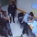 cop beating a man in a wheelchair